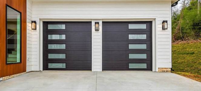 Two black modern garage doors with vertical frosted glass panels, contemporary garage door installation Ottawa